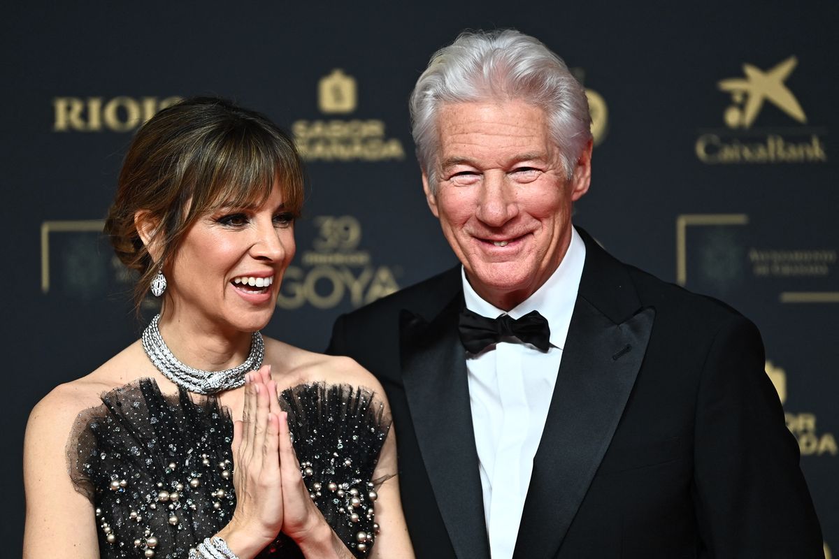 Richard Gere and his Spanish wife Alejandra Silva pose on the red carpet upon arrival prior the 39th Goya awards