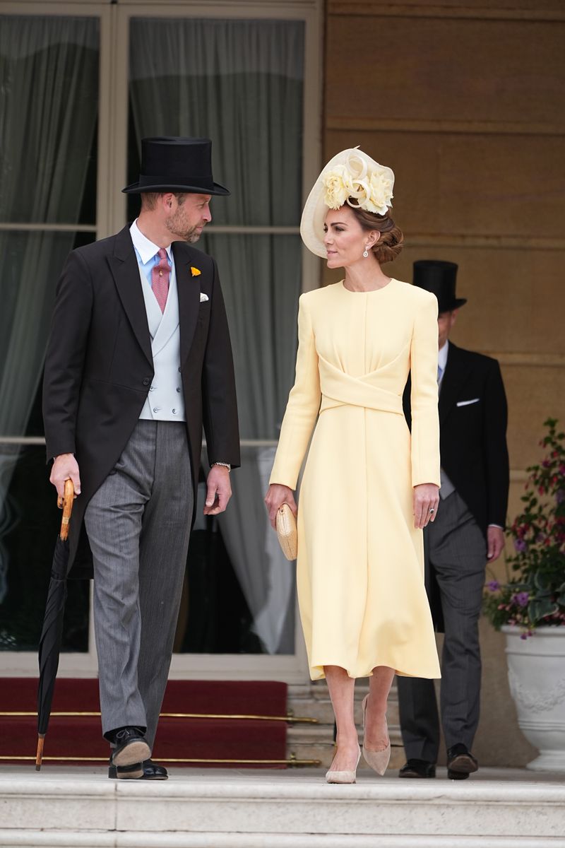 LONDON, ENGLAND - MAY 20: Prince William, Prince of Wales and Catherine, Princess of Wales stand at the top of the Garden steps before the start of a Royal Garden Party at Buckingham Palace on May 20, 2025 in London, England. (Photo by Aaron Chown - WPA Pool / Getty Images)