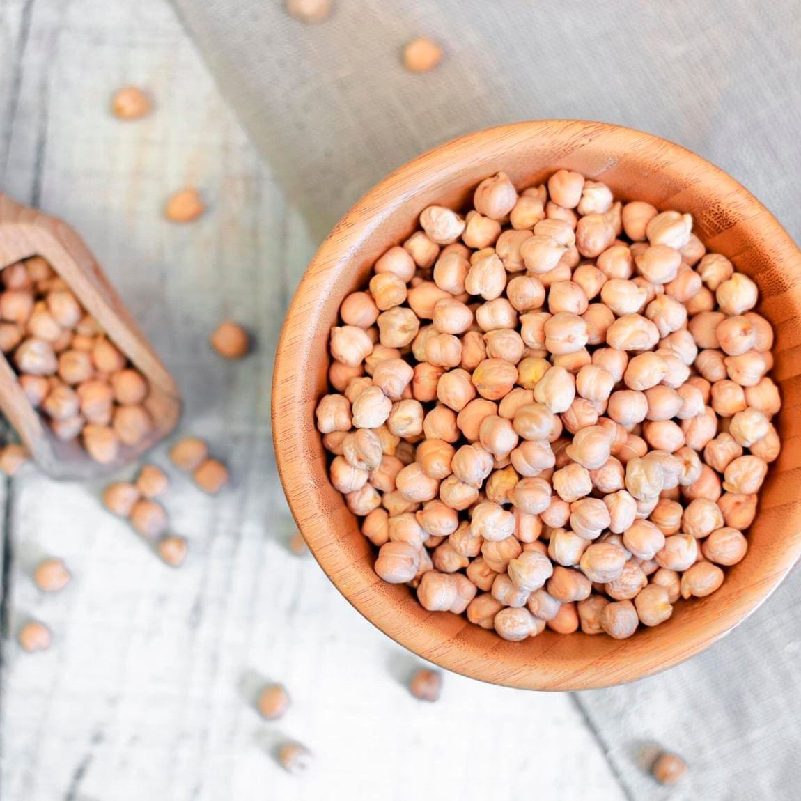 Dried chickpeas in a wooden bowl
