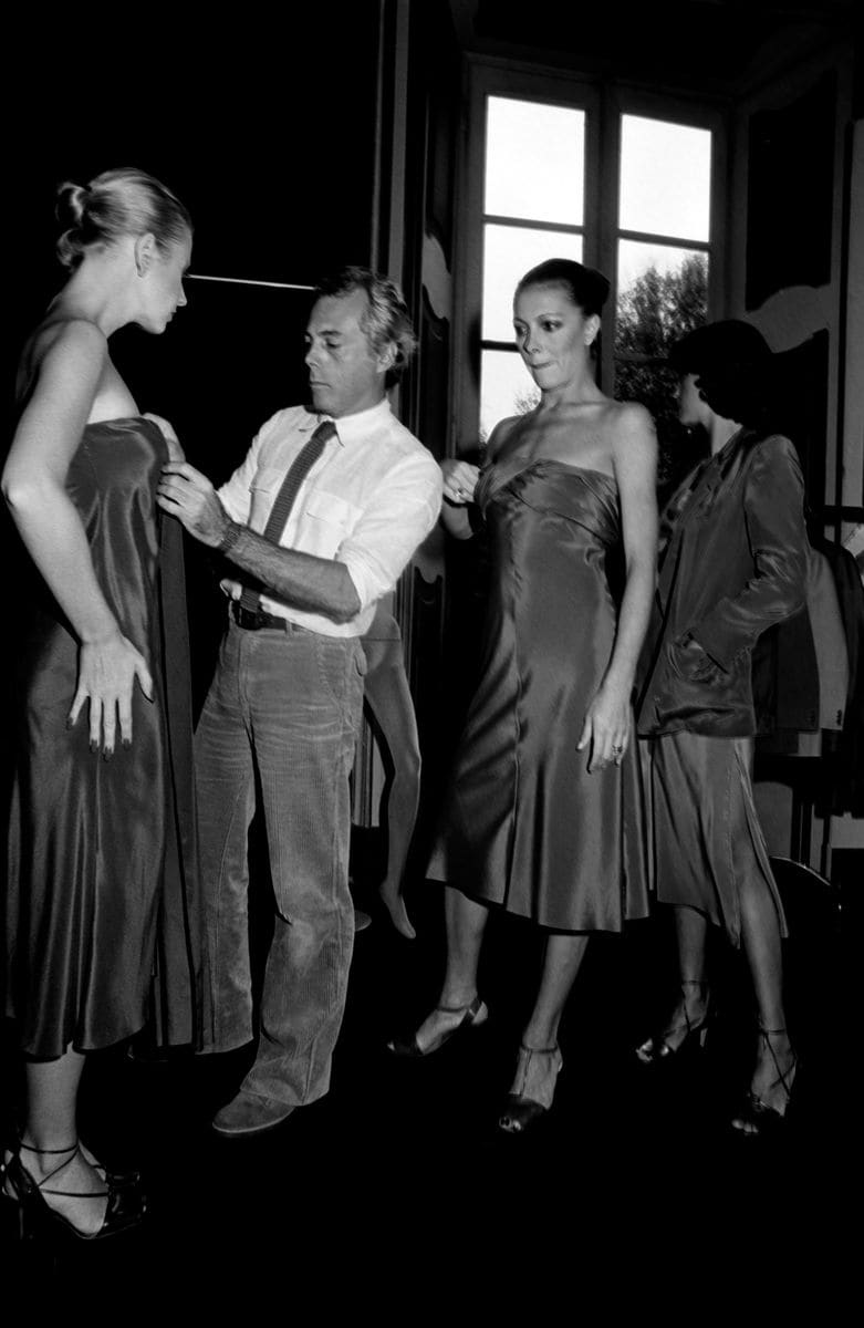 Designer Giorgio Armani Adjusts Models for Giorgio Armani Spring 1978 Ready to Wear Advance (Photo by Fairchild Archive/WWD/Penske Media via Getty Images)