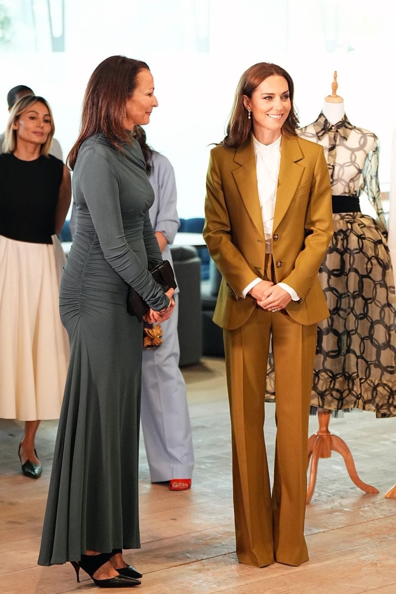 LONDON, ENGLAND - MAY 13:  Catherine, Princess of Wales tours design spaces with Caroline Rush, chief executive officer of the British Fashion Council during a visit to the British Fashion Councilat 180 Studios in central London, where she will present the Queen Elizabeth II Award for British Design on May 13, 2025 in London, England. (Photo by Aaron Chown - WPA Pool/Getty Images)