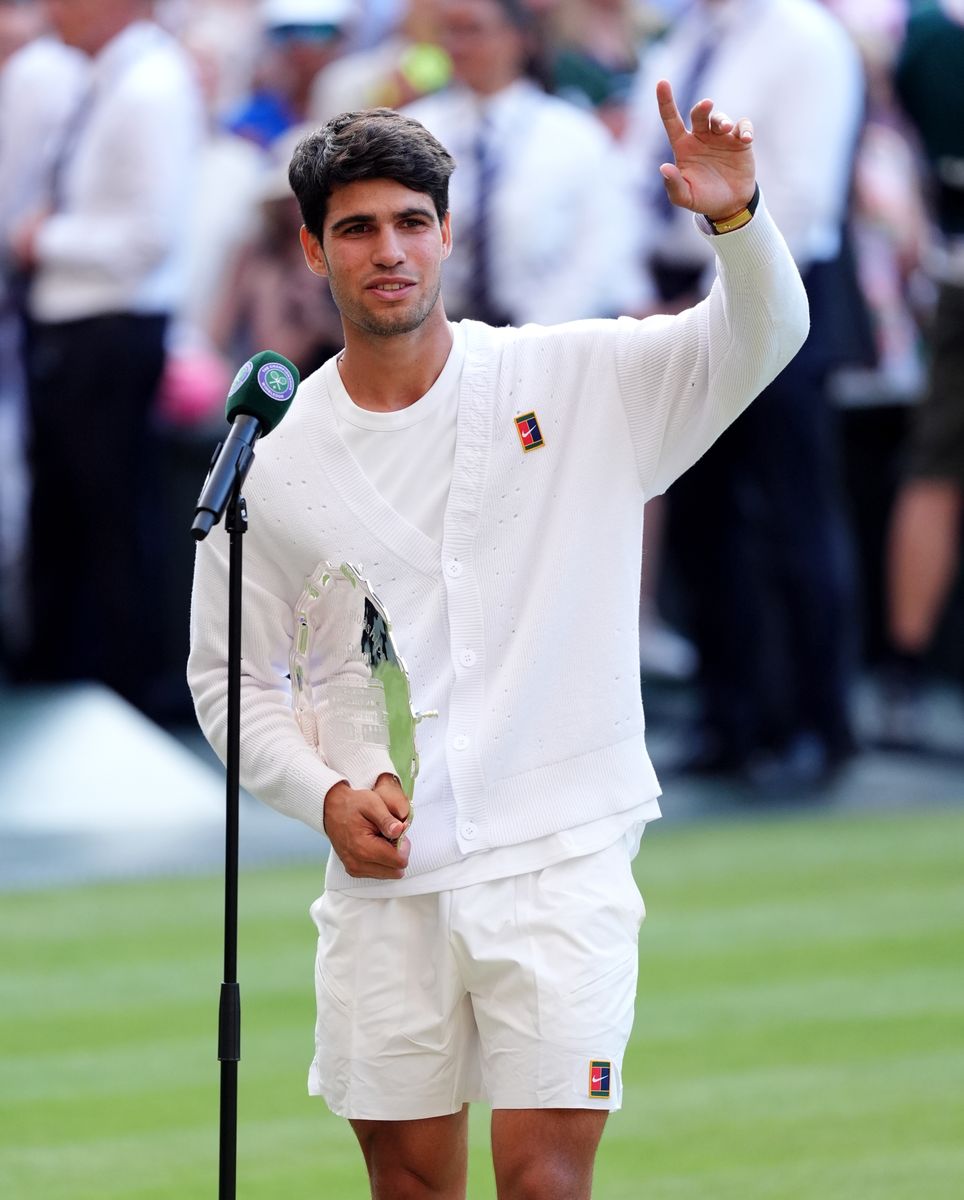 Carlos Alcaraz with the runners up trophy following his Gentlemen's Singles defeat to Jannik Sinner on day fourteen of the 2025 Wimbledon Championships at the All England Lawn Tennis and Croquet Club, London. Picture date: Sunday July 13, 2025. (Photo by John Walton/PA Images via Getty Images)