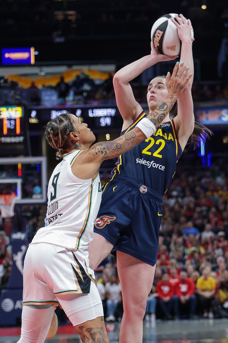 Caitlin Clark #22 of the Indiana Fever shoots the ball against Natasha Cloud #9 of the New York Liberty during the second half at Gainbridge Fieldhouse on June 14, 2025 in Indianapolis, Indiana. 