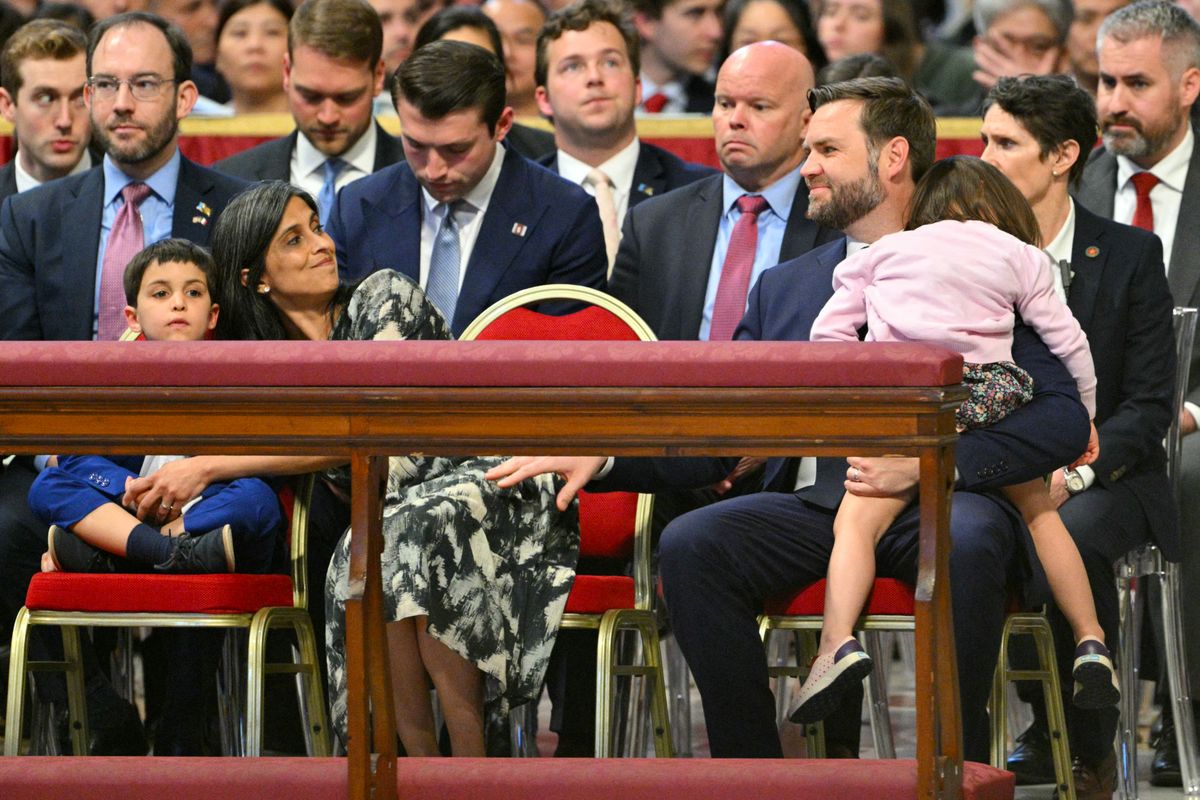 TOPSHOT - Second Lady Usha Vance, U.S. Vice President JD Vance and their children attend the celebration of the Passion of the Lord on Good Friday as part of the Holy Week celebrations, at St Peter's Basilica in the Vatican on April 18, 2025. (Photo by Andreas SOLARO / AFP) (Photo by ANDREAS SOLARO/AFP via Getty Images)          
