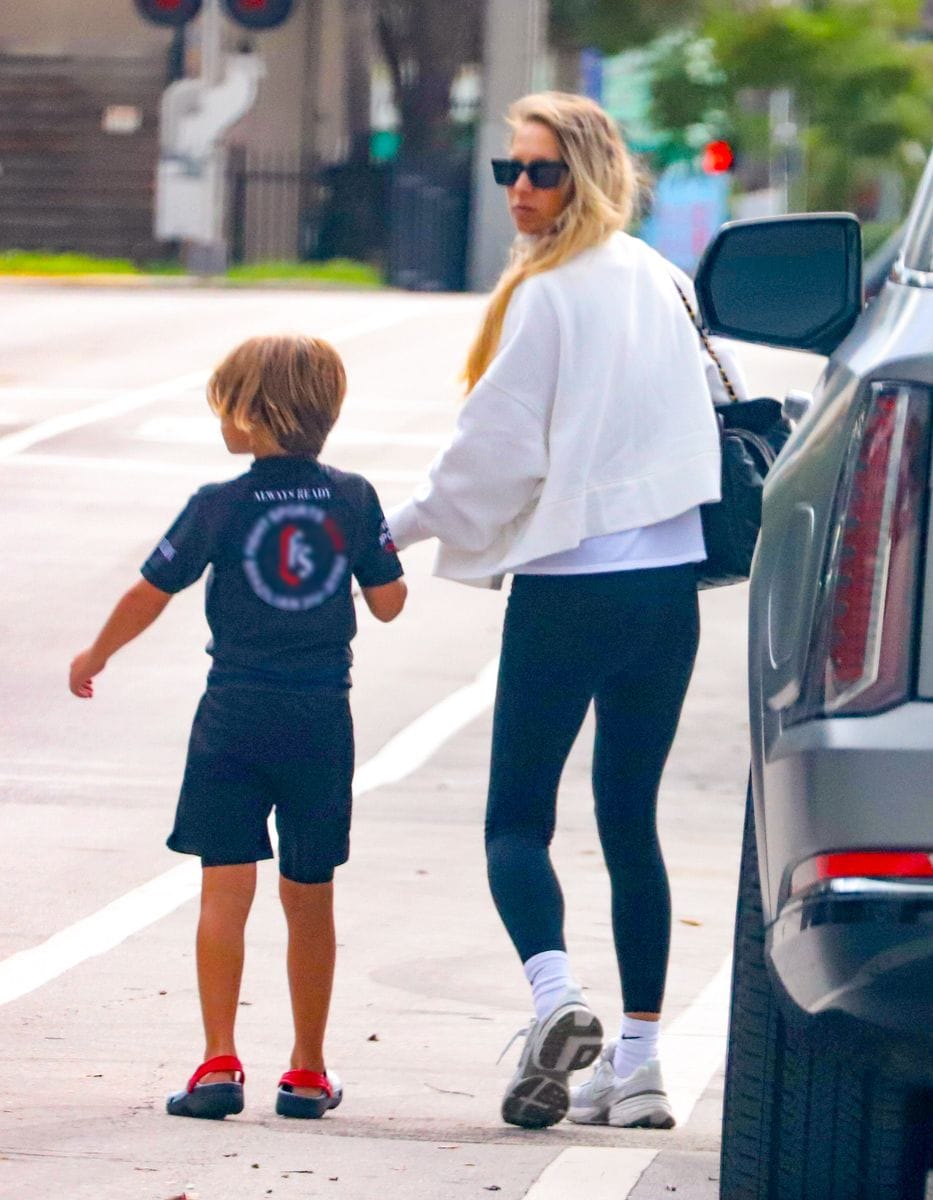 The 44-year-old retired tennis star, dressed in black leggings, a white oversized jacket, and sneakers, held her son’s hand as they crossed the street. 