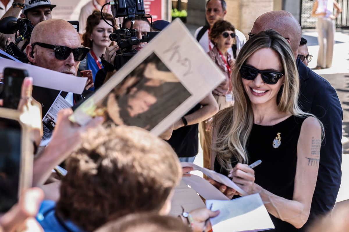 Angelina Jolie is seen signing autograph during the 81st Venice International Film Festival 