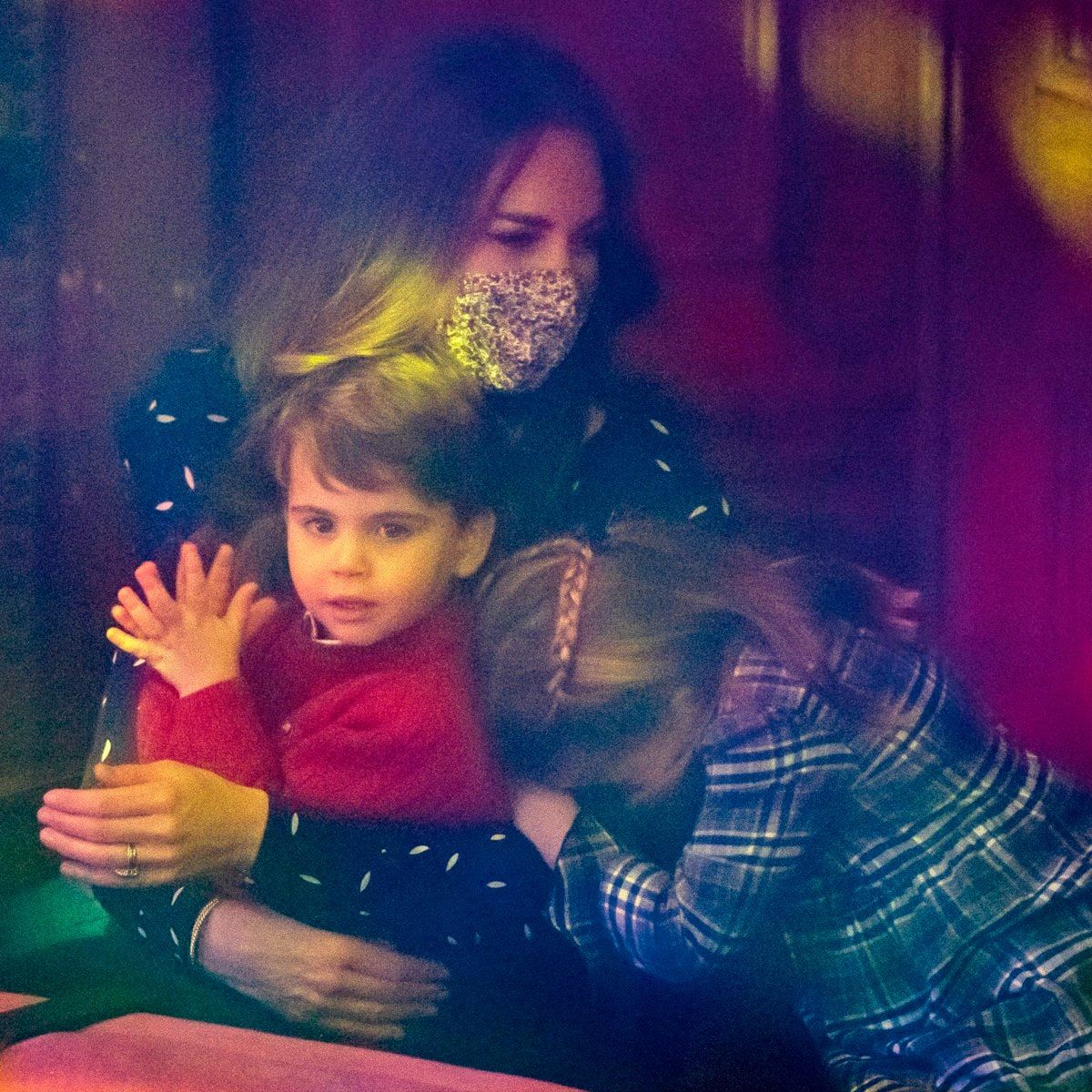 Louis, who was seen clapping, sat comfortably on his mom's lap in the Royal Box.