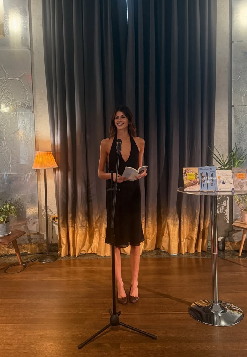 Kaia hosted the event dressed in a sultry black halter midi dress