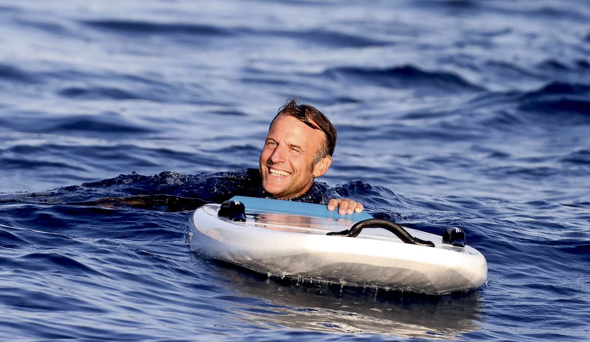 Macron was photographed enjoying himself as he played different water sports