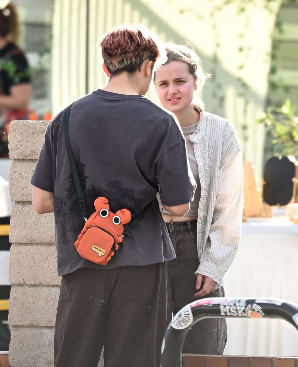 Vivienne Jolie and Knox Jolie are seen sharing a sweet moment together outside of an event where Vivienne was selling artwork.