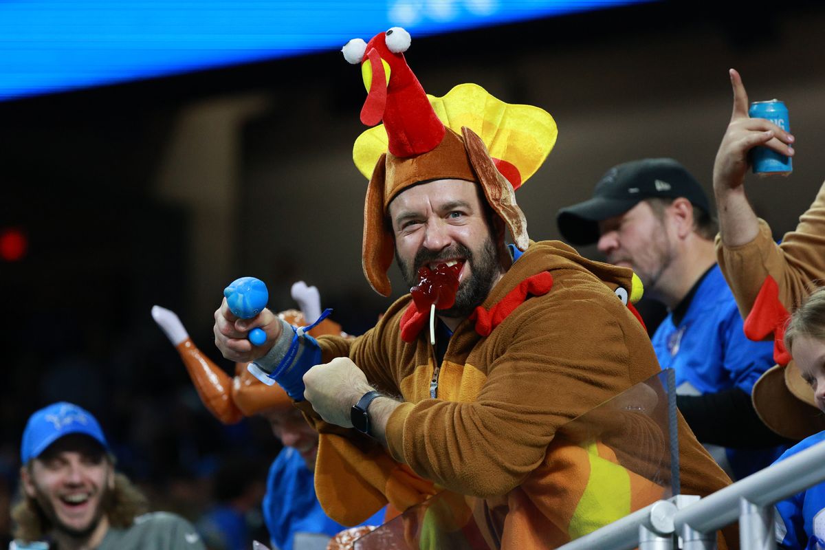 Detroit Lions fan cheers during the second half of an NFL Thanksgiving Day football game between the Chicago Bears and the Detroit Lions.