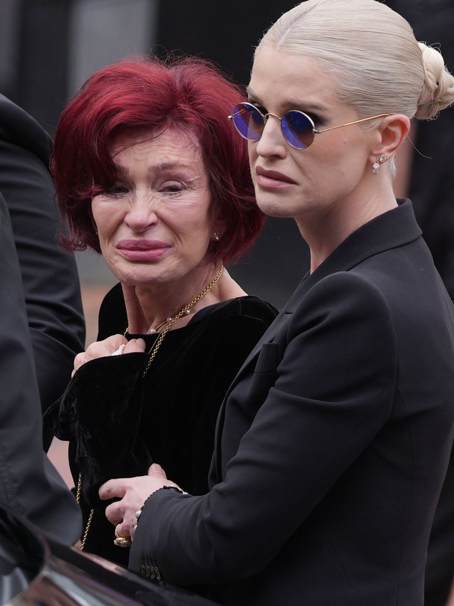 Sharon Osbourne and Kelly Osbourne stop to view tributes to the late Ozzy Osbourne.