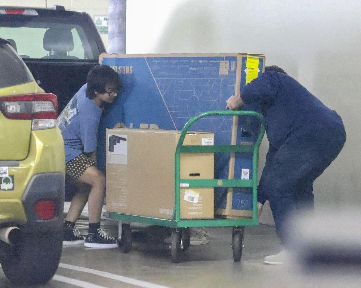 Maddox and a store employee were seen moving the TV