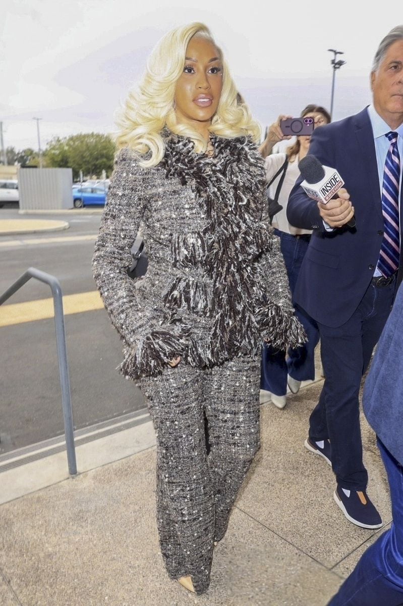 
Cardi B makes a fashionable entrance to court in Los Angeles for her civil trial, where a former security guard claims the rapper spit on her, ridiculed her, and cut her with a fingernail.
