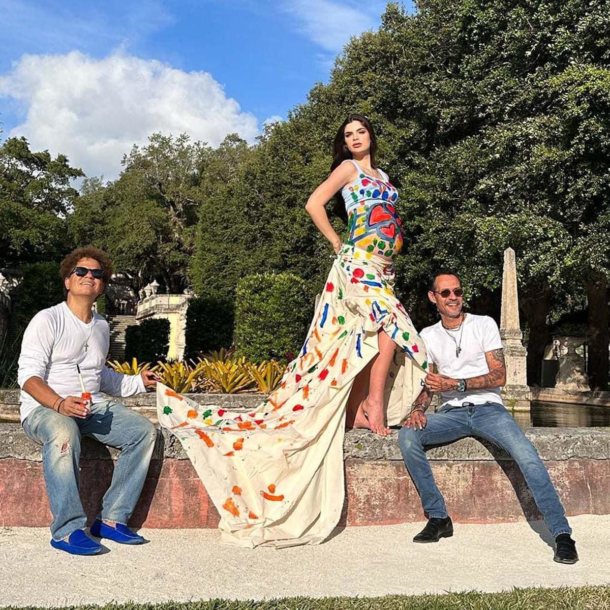 Romero Britto and Marc Anthony painting Nadia’s baby belly