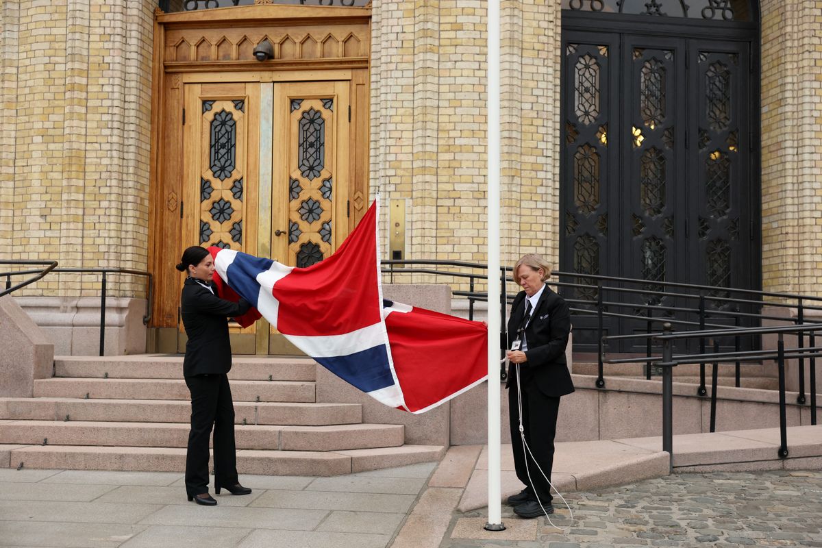 Staff raise the Norwegian national flag to half-mast before the start of the new king's swearing-in ceremony to the Constitution, in front of Parliament, in Oslo, on September 1, 2026.