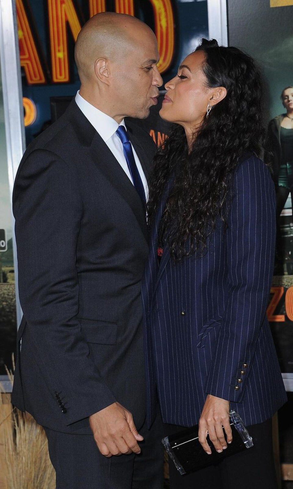 Rosario Dawson and Cory Booker kiss during rare red carpet appearance