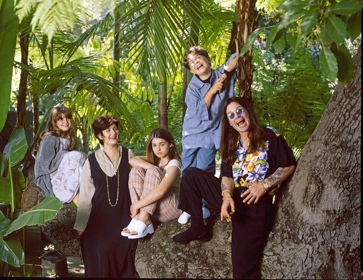 Ozzy Osbourne alongside his family in the grounds of his luxury home in Beverly Hills, California, in 1997