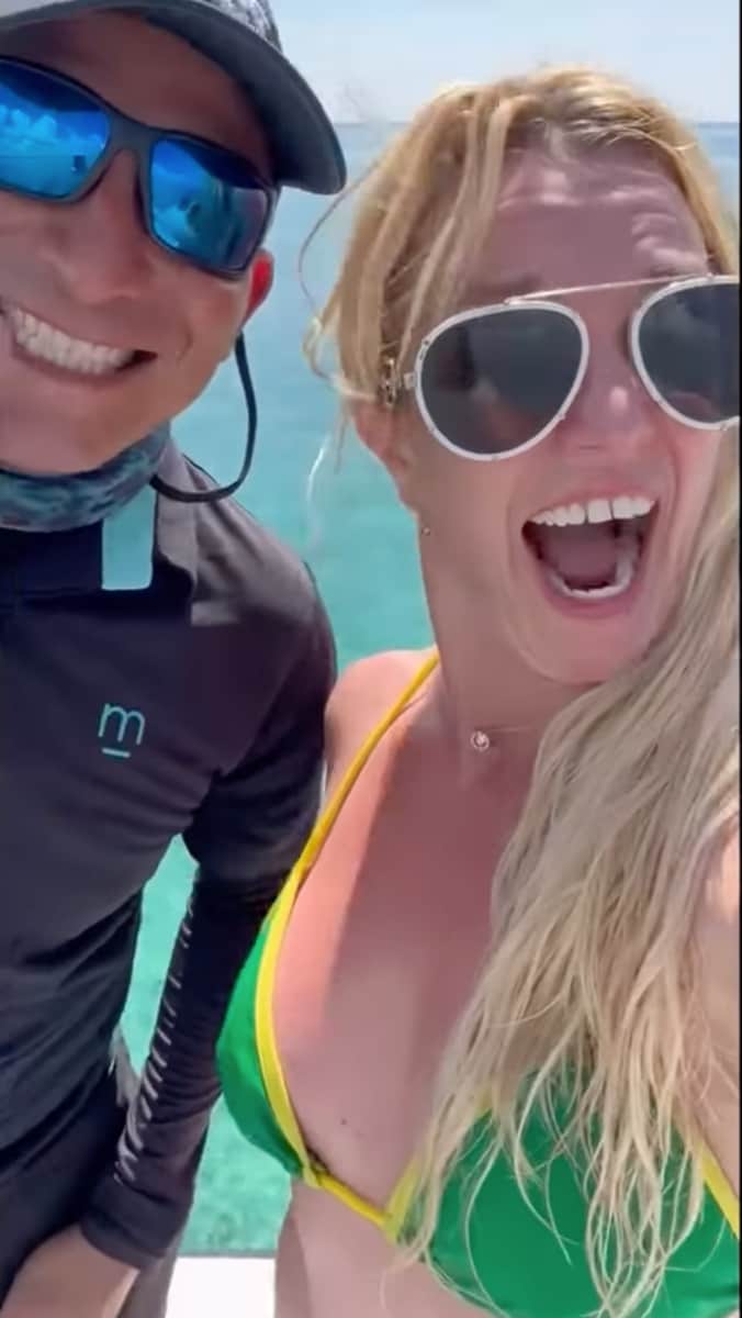 Britney Spears shows excitement as she dances to Justin Timberlake's song while on a yacht