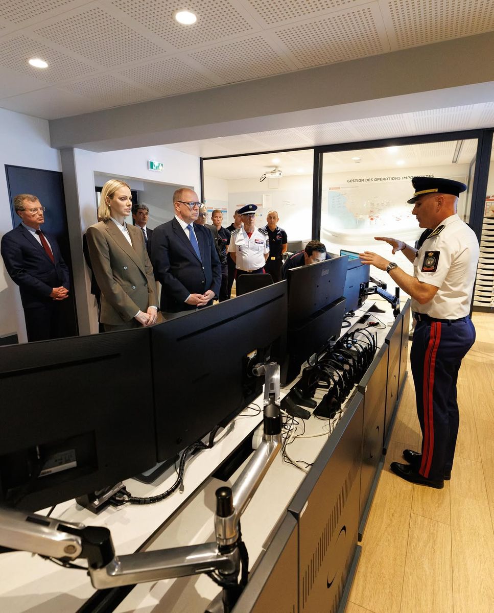 The princely couple received updates from officials during their visit to Monaco's emergency operations center.