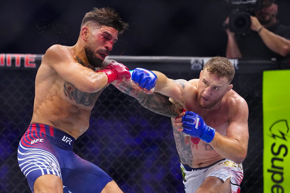 Justin Gaethje celebrates after defeating Topuria and capturing the UFC lightweight championship.