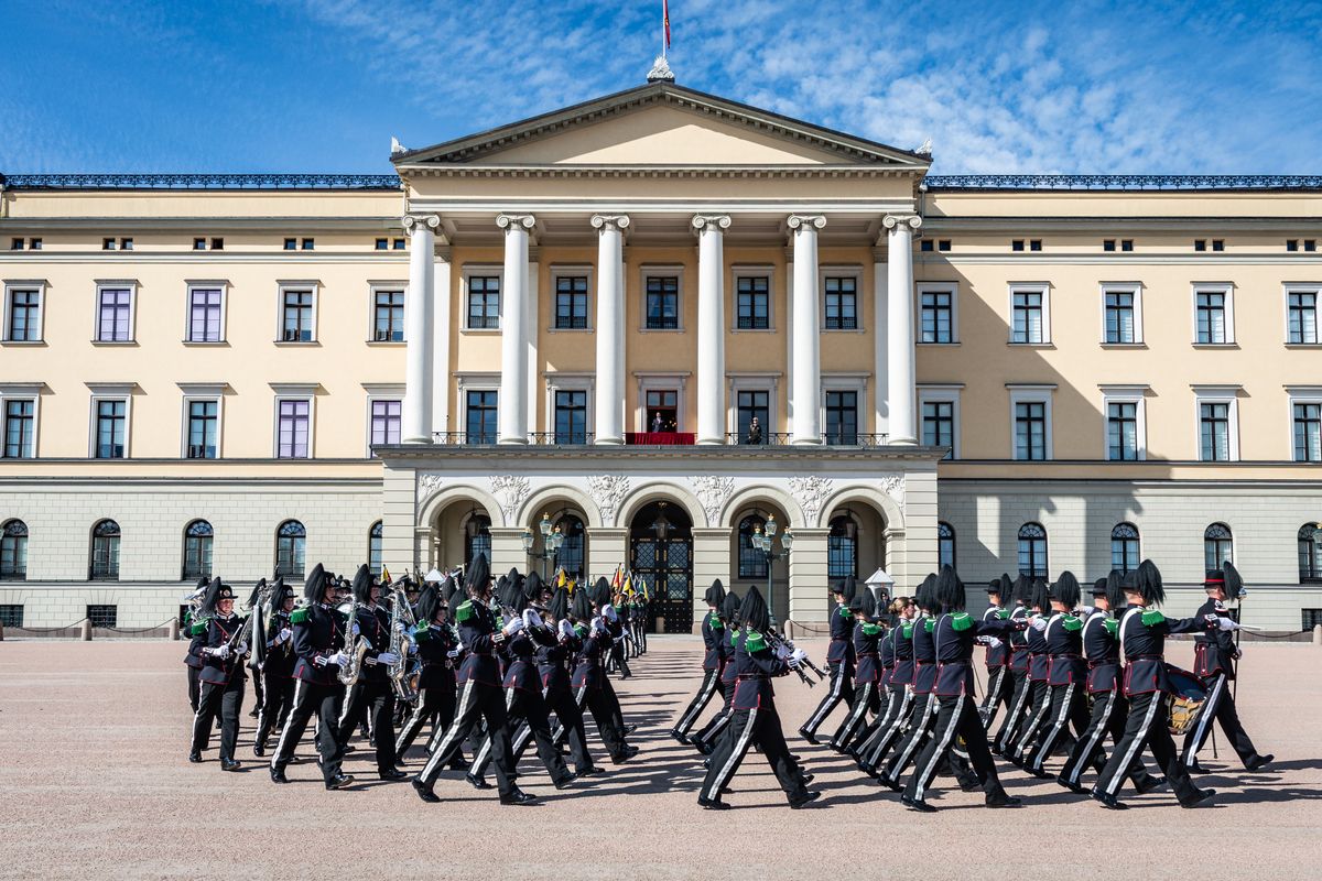Crown Prince Haakon watches the Royal Guard and its marching band perform outside the Royal Palace in Oslo.