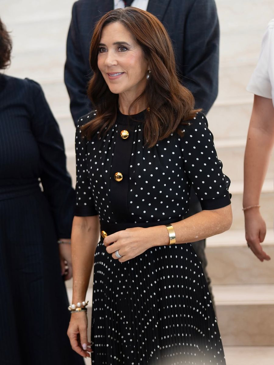 The Danish Queen gave the classic polka-dot print a glamorous update with statement gold buttons and a waist-defining silhouette.