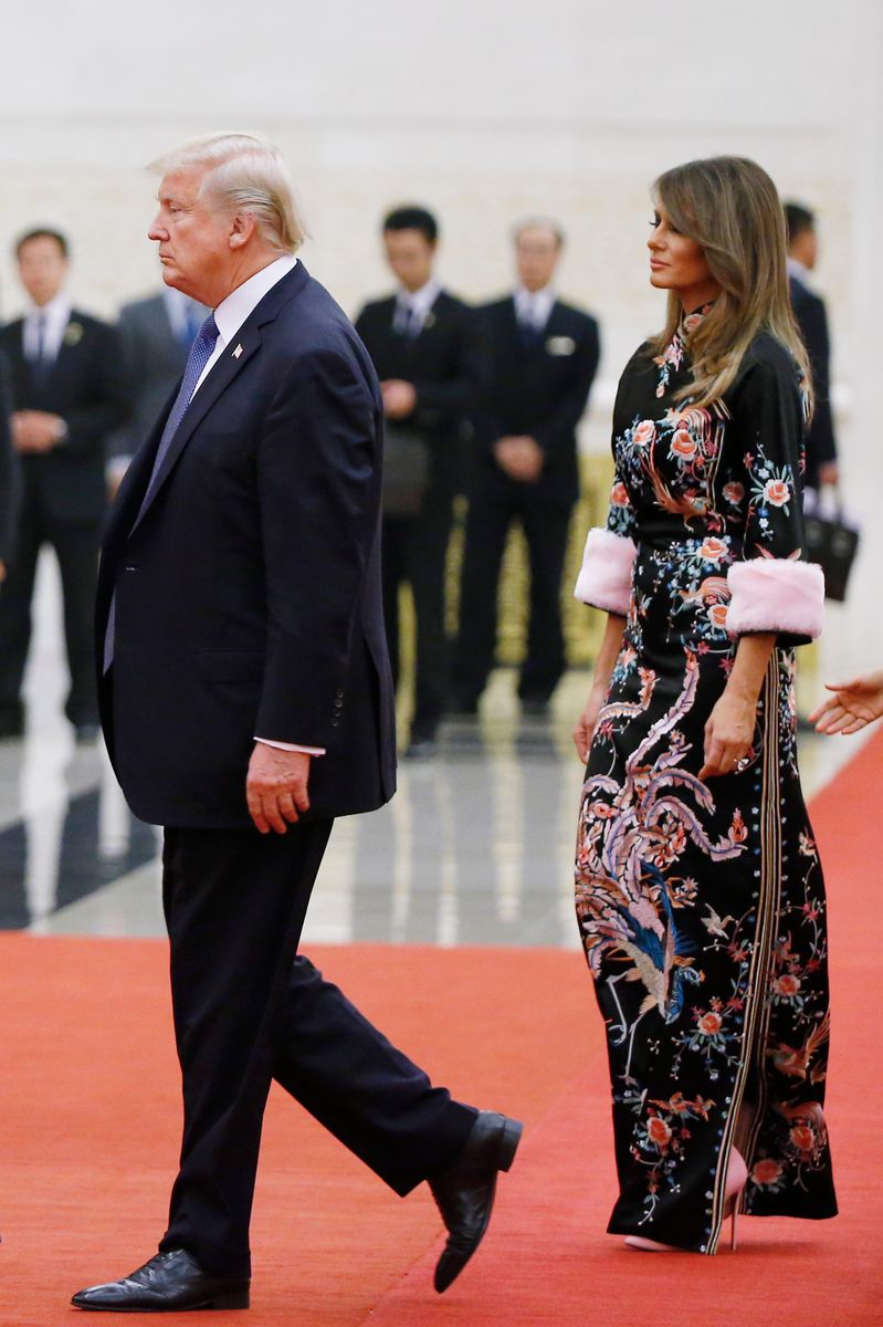 As Donald Trump returns to China this week without Melania Trump by his side, memories of one of her most talked-about diplomatic fashion moments have resurfaced once again. 