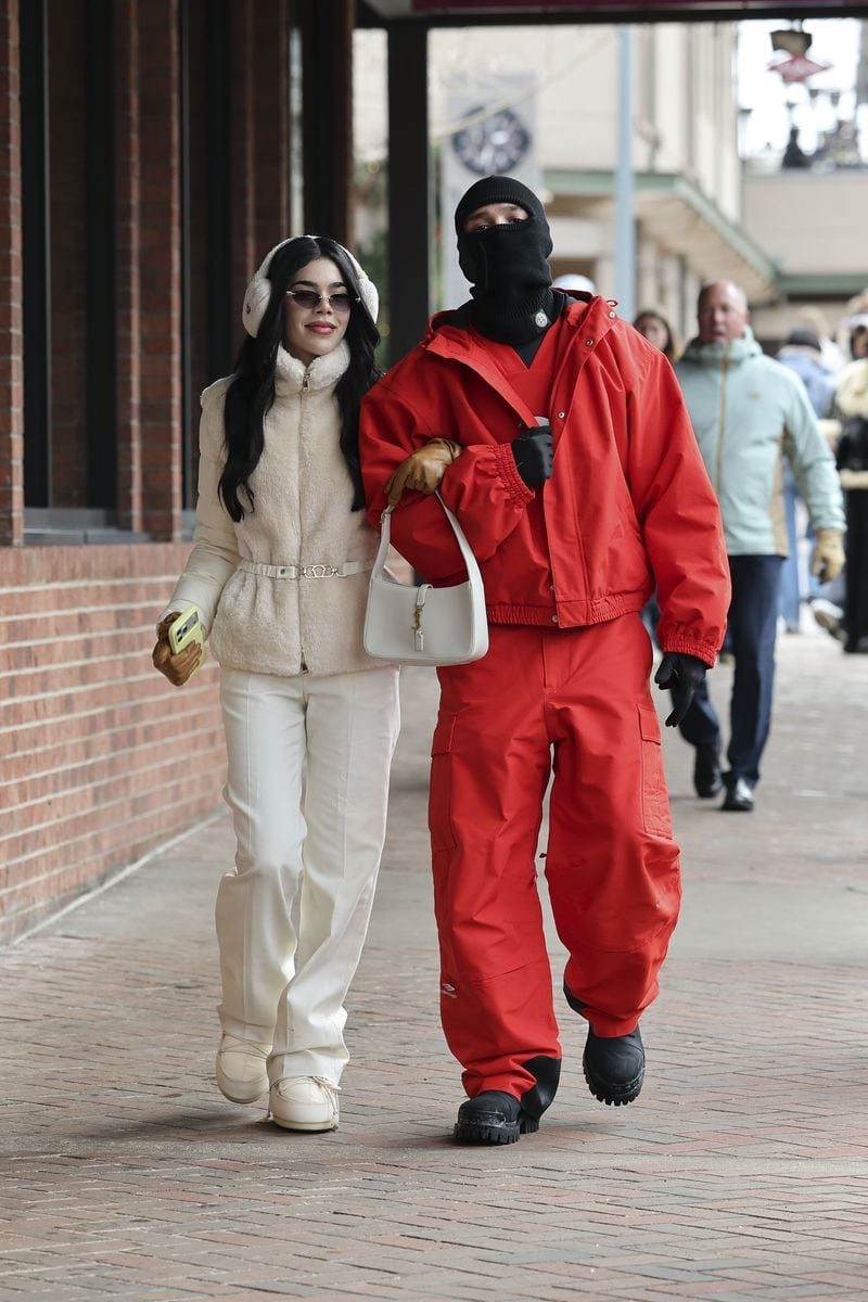 Peso Pluma and Kenia OS were seen walking together through the streets of Aspen during their winter vacation. 