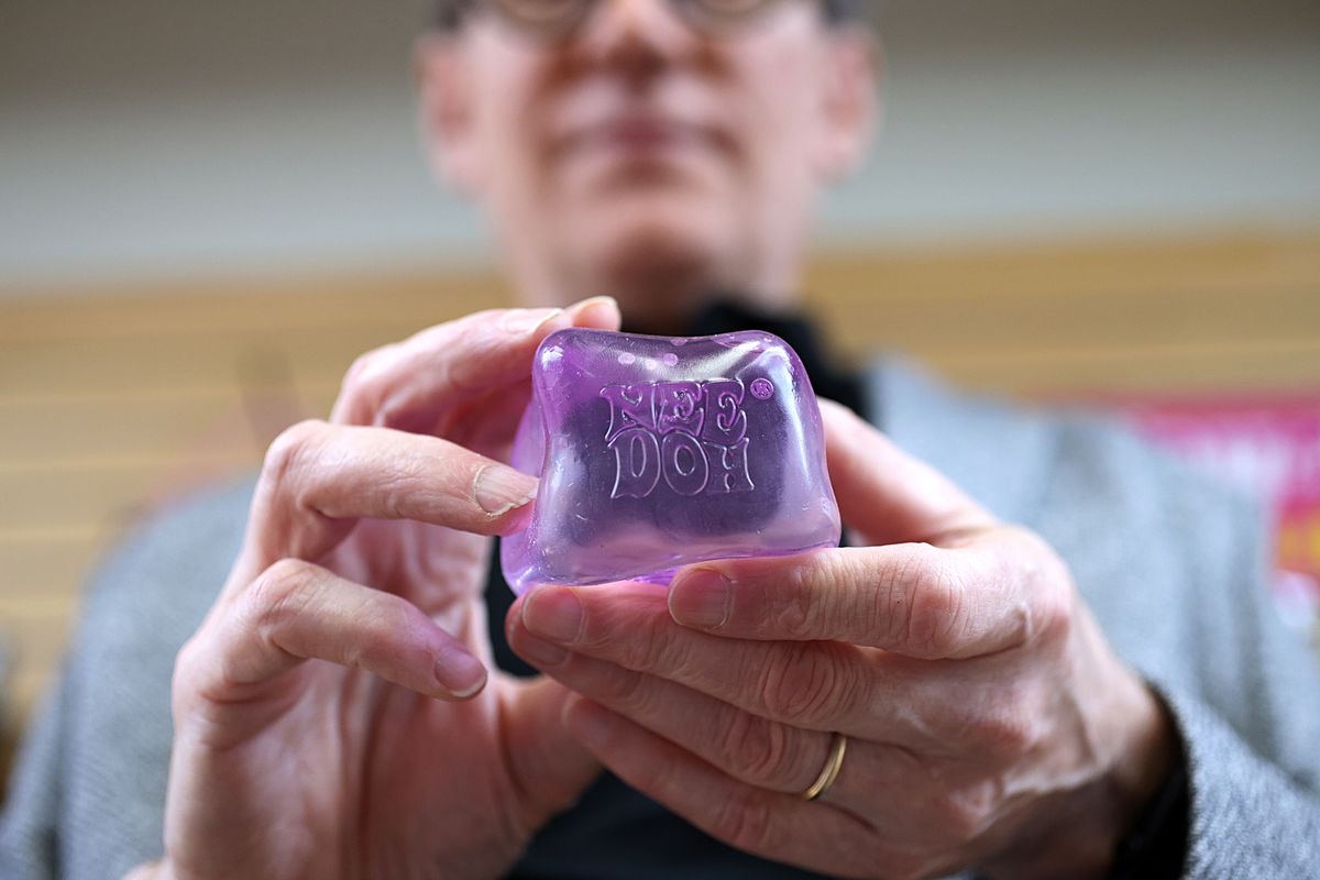 Paul Weingard, president and CEO of Schylling, holds a NeeDoh 