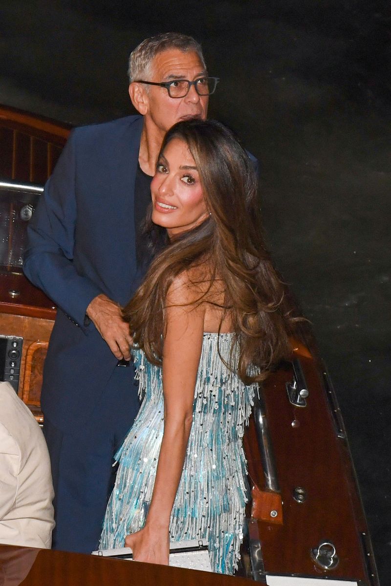 George and Amal Clooney arrived at Ivo Restaurant by boat in Venice, Italy. 