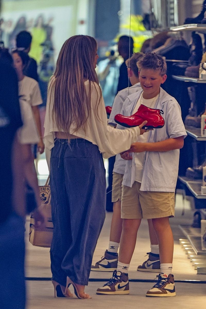 Photos captured Samuel grinning as Lopez held out the eye-catching footwear.
