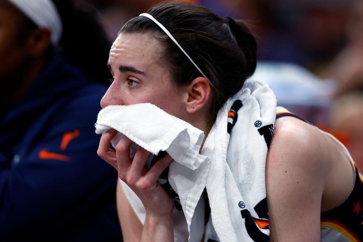 Caitlin Clark sits on the bench after her injury in the fourth quarter at TD Garden on July 15, 2025