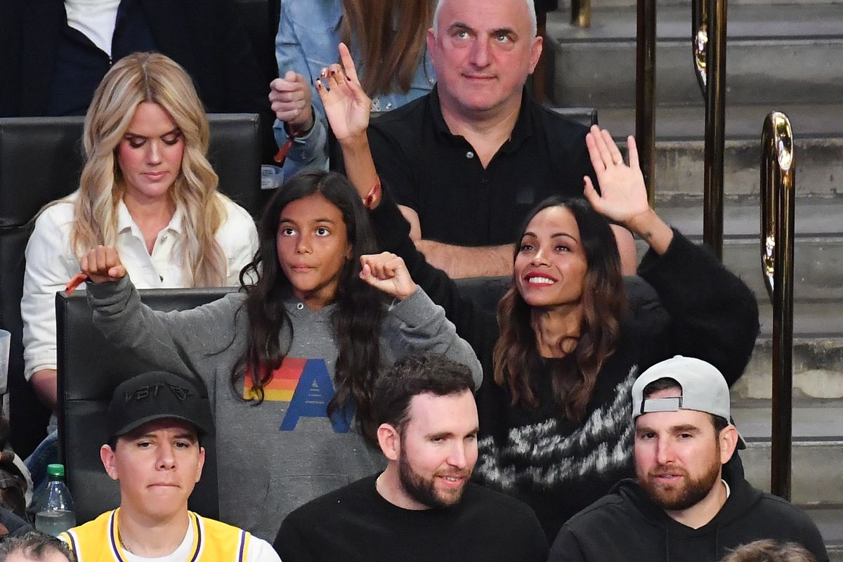 Zoe Saldana and her son attend a basketball game between the Los Angeles Lakers and the Golden State Warriors at Crypto.com Arena on April 03, 2025 in Los Angeles, California. 