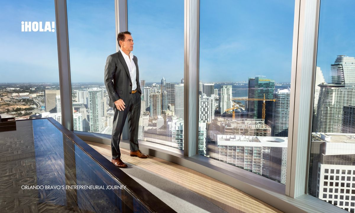Orlando Bravo stands by the floor-to-ceiling windows of his Miami office, gazing out over the city’s skyline, reflecting on his entrepreneurial journey.