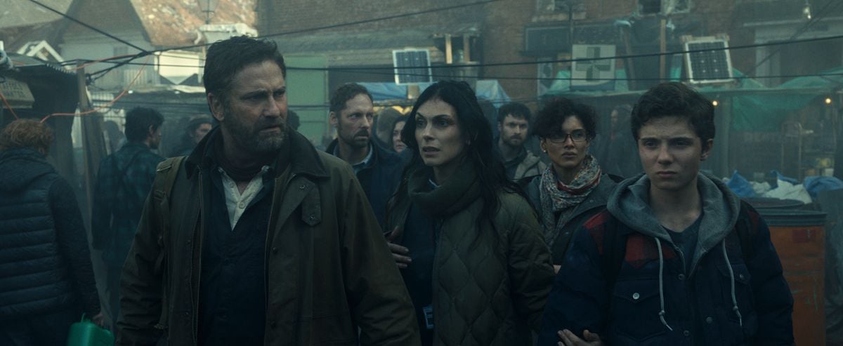 Gerard Butler as John Garrity, Morena BaccarinÂ as Allison Garrity, Amber Rose Revah as Dr. Casey Amina, and Roman Griffin DavisÂ as Nathan Garrity in Greenland 2: Migration. Photo Credit: Courtesy of Lionsgate 