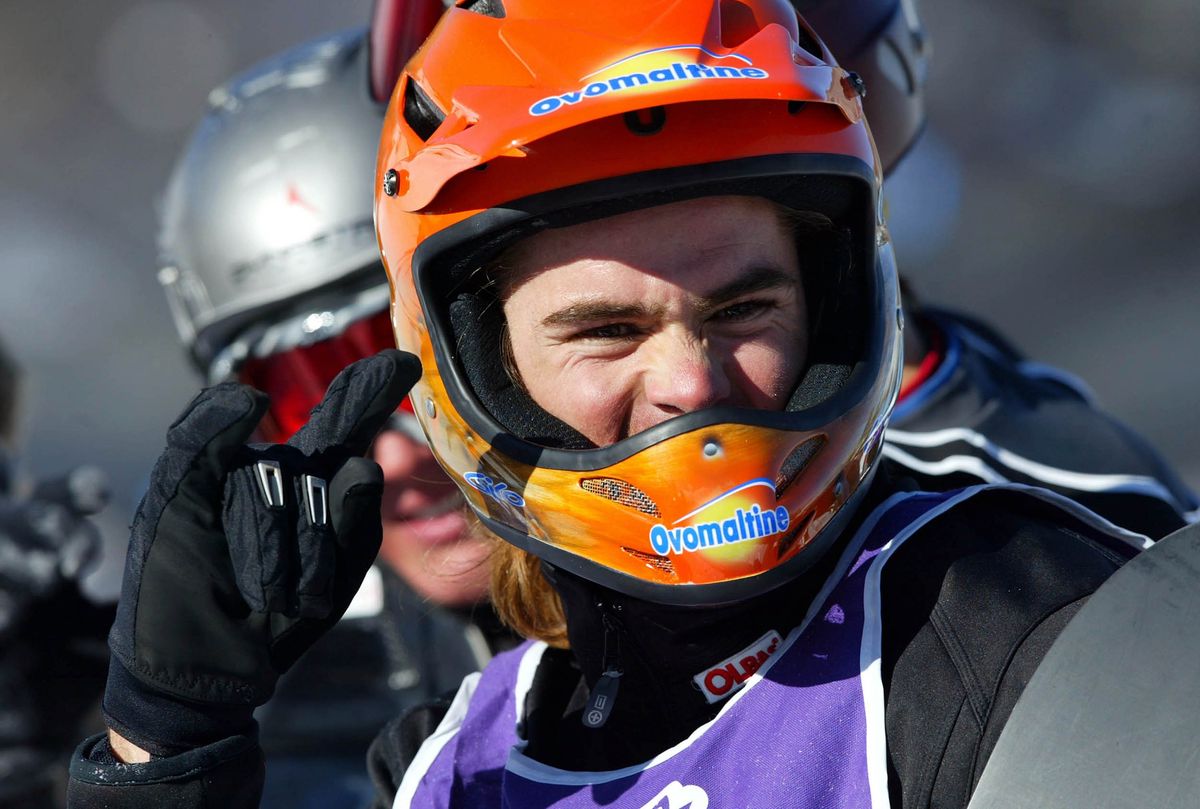 Ueli celebrates winning the final of the Men's Snowboarder X portion of the VIII Winter X Games on January 26, 2004 