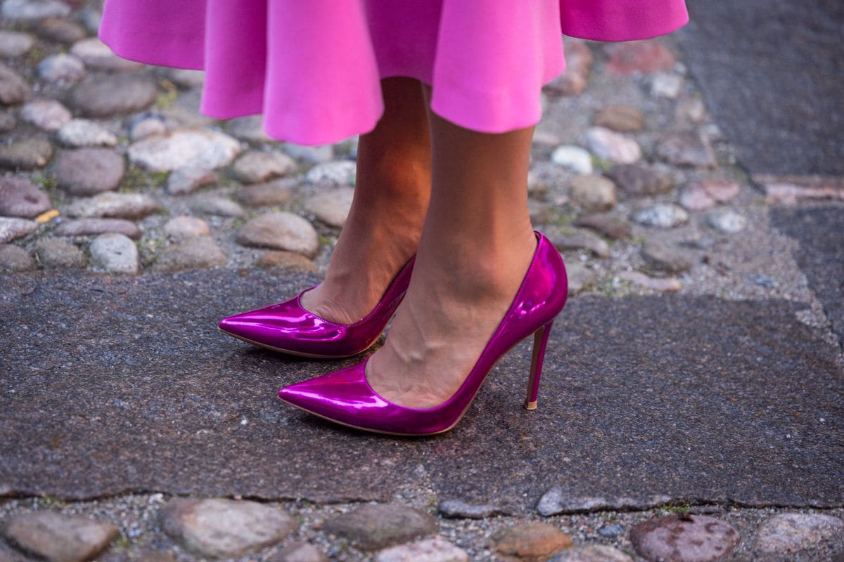 Crown Princess Victoria of Sweden wore the Gianvito Rossi 'Gianvito 105' stilettos, crafted in a fuchsia mirrored leather finish that made a statement. 