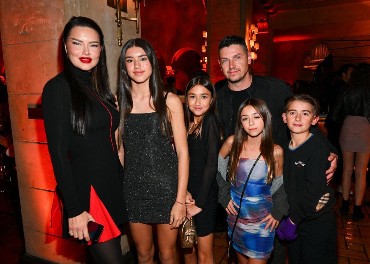 Adriana Lima, Valentina Jari, Sienna Jari, Andre Lemmers and children at the premiere of "The Hunger Games: The Ballad of Songbirds & Snakes"