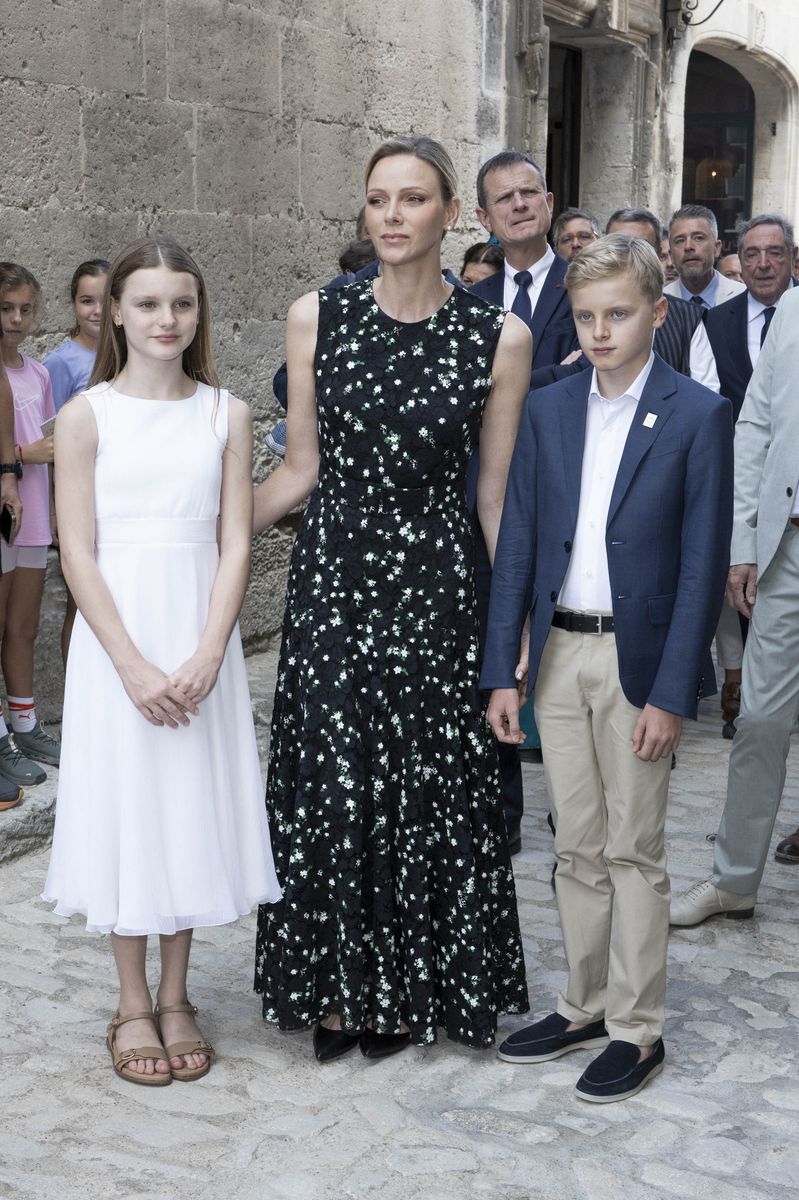 Princess Charlene steps out with her family in a black dress reminiscent of one Queen Letizia wore a decade ago