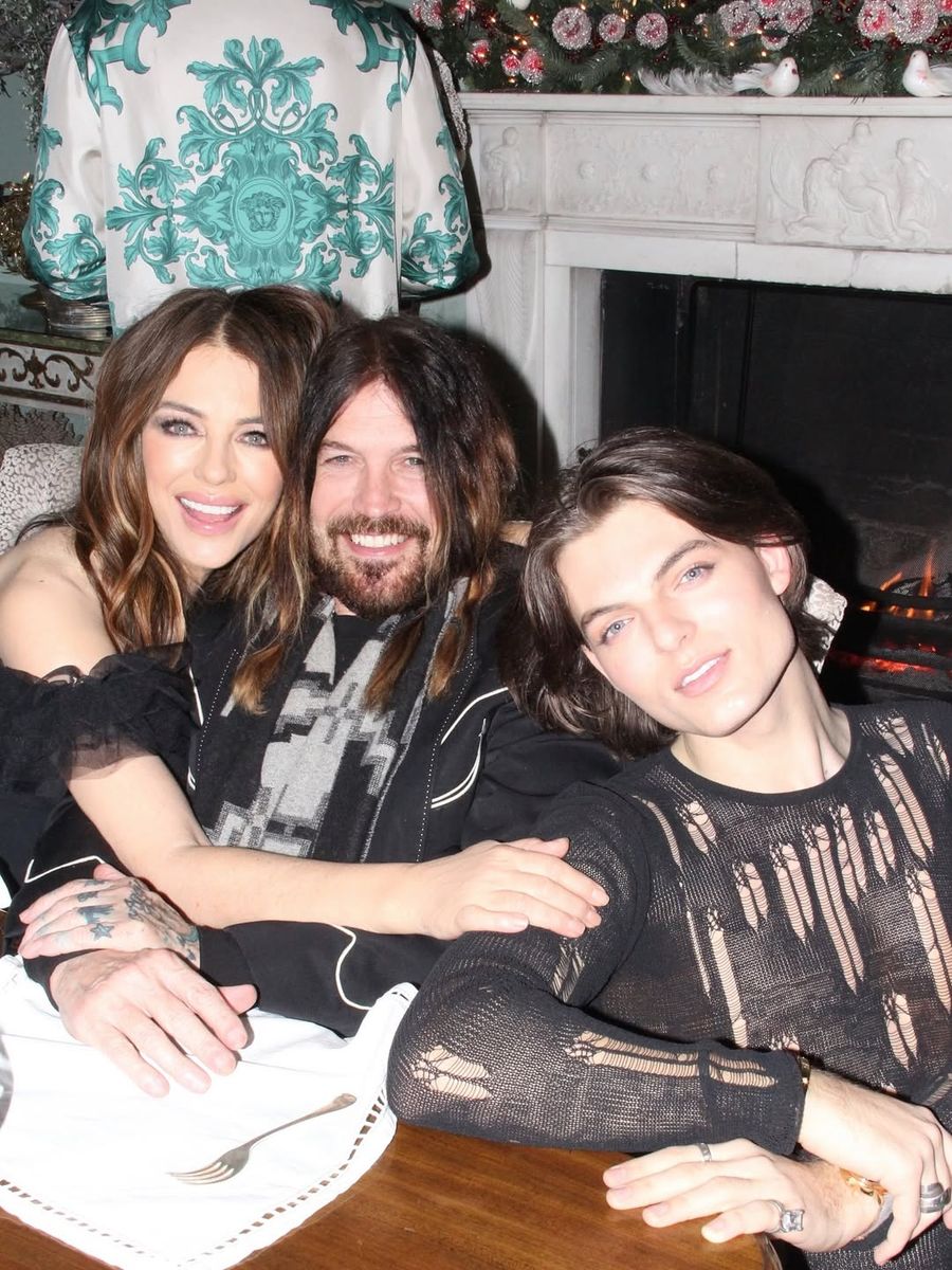 Hurley and Cyrus were accompanied by her son, Damian