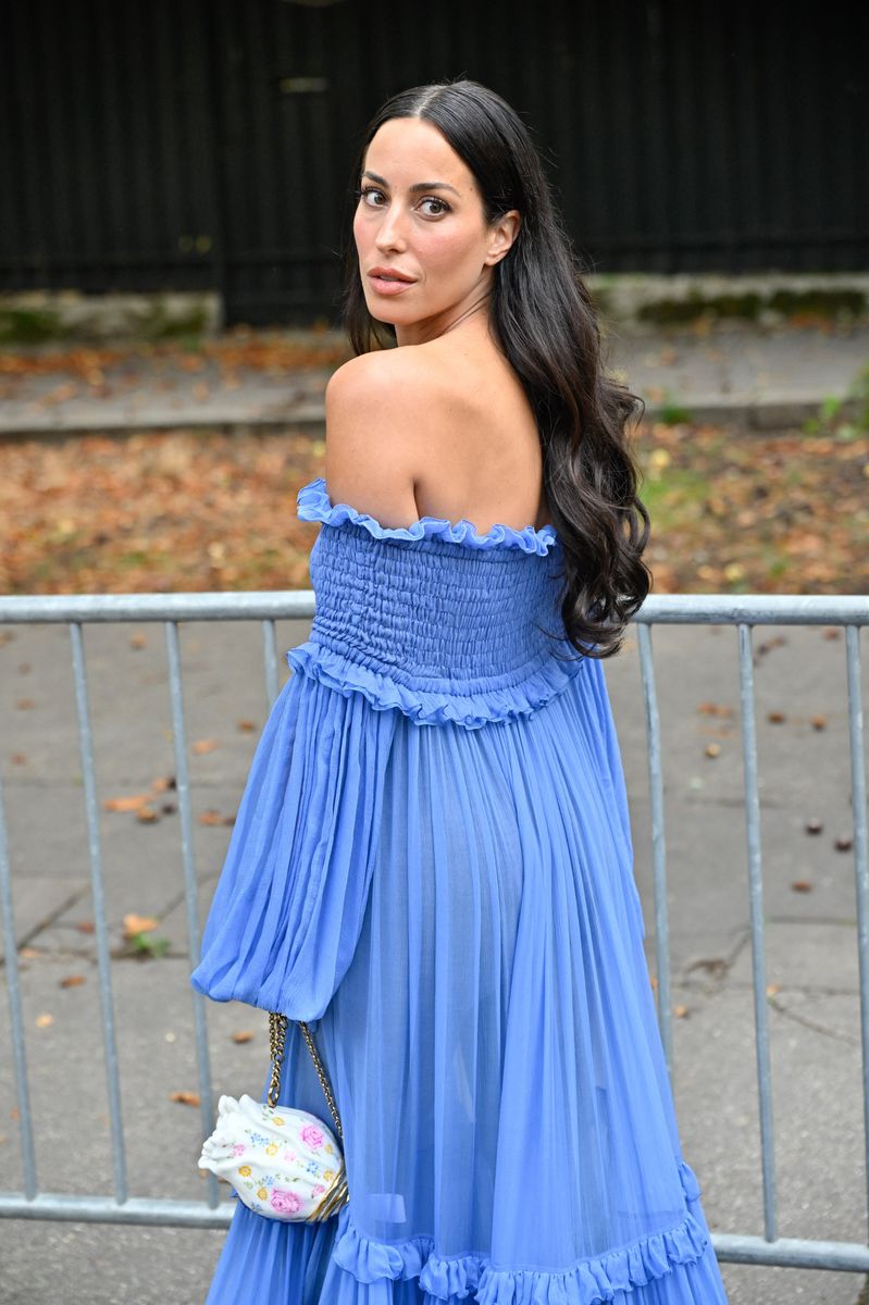 Ines de Ramon arrived at Chloé’s Paris Fashion Week show in a flowing blue dress with sheer panels and cascading ruffles.