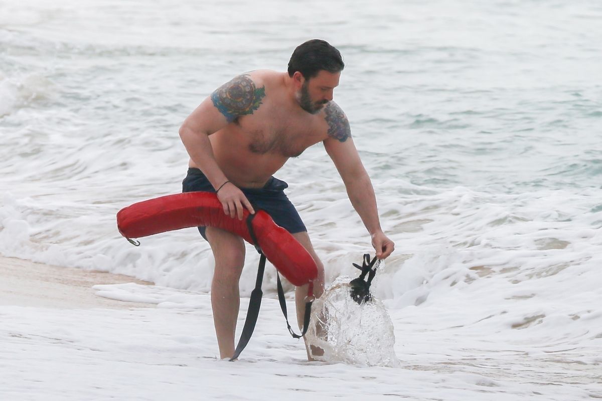 Photo © 2018 Backgrid/The Grosby Group
Spain: Lagencia Grosby
 
EXCLUSIVE
Honolulu, HI, March 15, 2018.
Ben Affleck shows off a huge back tattoo while filming "Triple Frontier." Ben was seen getting out of the ocean with life guard equipment as he sports three colorful tattoos: one on each shoulder, and a giant Phoenix on his back. All were seen training under the strict supervision of Hawaii lifeguards as they prepared for their new movie "Triple Frontier" which is being produced for Netflix.