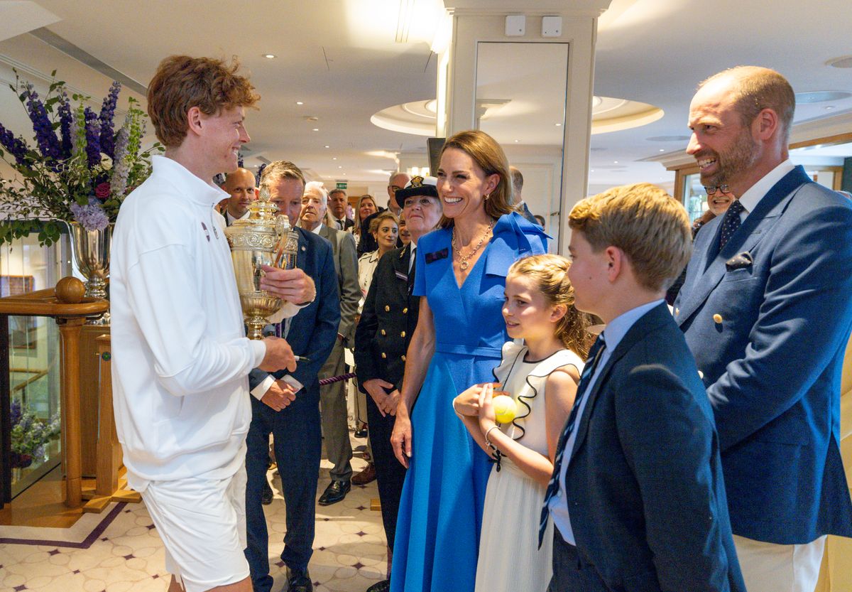 Jannik Sinner (ITA) holds the Gentlemen's Singles Trophy as he meets with HRH The Princess of Wales, Patron of the All England Lawn Tennis Club, HRH The Prince of Wales, Princess Charlotte of Wales, and Prince George of Wales, in the Clubhouse after winning the Gentlemen's Singles Final at The Championships 2025. Held at The All England Lawn Tennis Club, Wimbledon. Day 14 Sunday 13/07/2025. Credit: AELTC/Andrew Parsons.