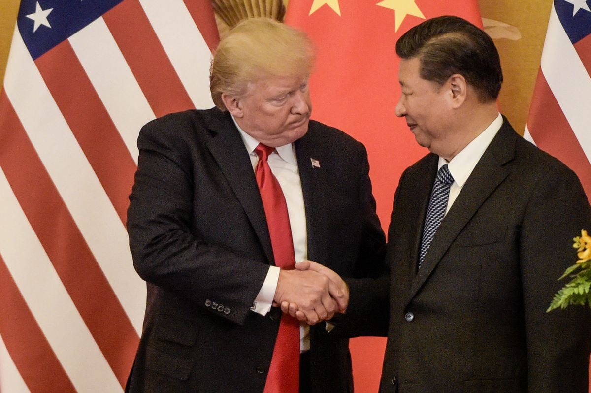 US President Donald Trump shakes hand with China's President Xi Jinping 