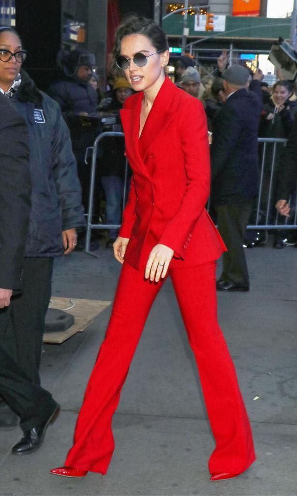 Daisy Ridley in a red blazer and bell-bottom outfit