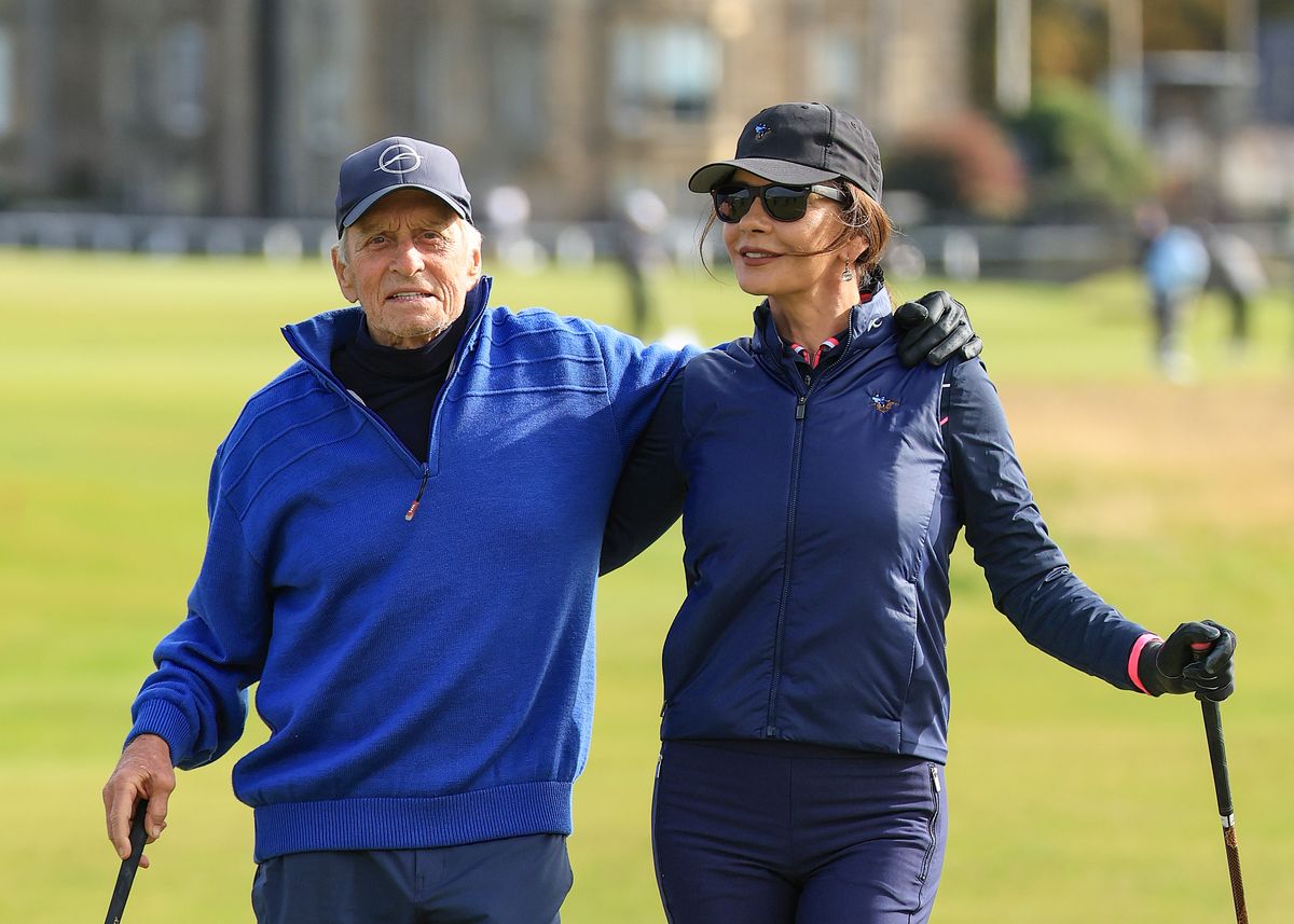 Michael Douglas and Catherine Zeta-Jones playing golf at The Old Course in 2025