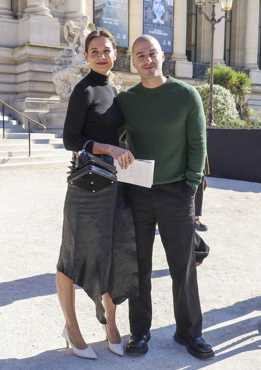 Jason Bard Yarmosky wore a forest-green crewneck sweater, black wide-leg trousers, and black chunky dress shoes.