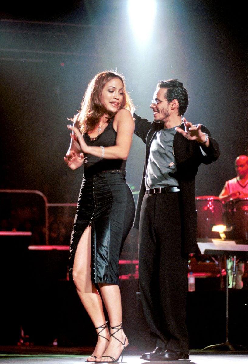 Marc Anthony performs onstage with Jennifer Lopez at Madison Square Garden concert, New York, New York, September 26, 1998. 