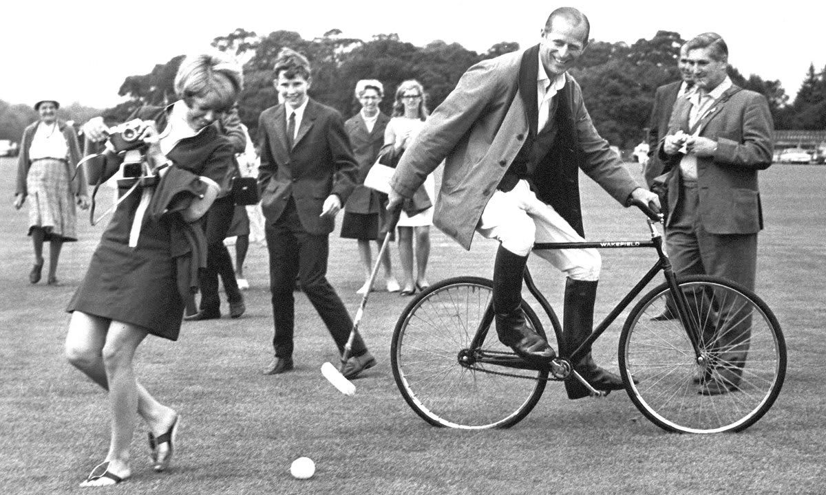 Prince Philip was pictured in 1964 practicing bicycle polo.